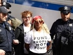 New York City Police Department (NYPD) officers detain US actress Susan Sarandon (C) and other pro-Palestinian demonstrators who were blocking First Avenue near the United Nations headquarters building, ahead of Israel's Prime Minister Benjamin Netanyahu's address to the 81st United Nations General Assembly in New York on September 24, 2026. (Photo by CHARLY TRIBALLEAU / AFP)