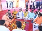Uttar Pradesh chief minister Yogi Adityanath at a groundbreaking ceremony for two housing schemes in Lucknow on Thursday. (HT PHOTO)