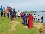 Villagers gather at the mishap site near Koel river on Wednesday (HT PHOTO)