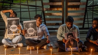 Students hold candles in memory of the second-year IIT Bombay student who died by suicide. (Satish Bate/ HT Photo)