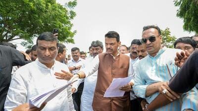 Maharashtra Chief Minister Devendra Fadnavis interacts with people while inspecting the areas affected by a drought-like situation in Washim on Thursday. (@CMOMaharashtra X)