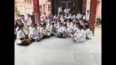 Outsourced employees stage a protest at the hospital in Kaushambi on Thursday (HT) Outsourced employees stage a protest at the hospital in Kaushambi on Thursday (HT)