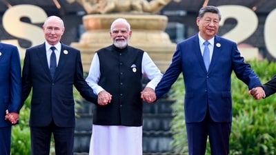 Russian President Vladimir Putin, Prime Minister Narendra Modi and Chinese President Xi Jinping pose for a group photograph at 18th BRICS Summit, in New Delhi. (PTI)