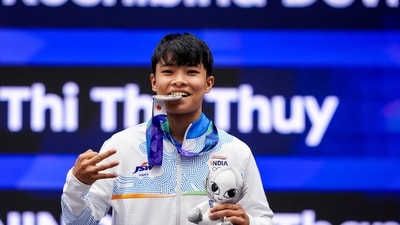 Roshibina Devi Naorem holds the silver medal after the Women's 60kg Wushu final match during the 20th Asian Games (PTI)