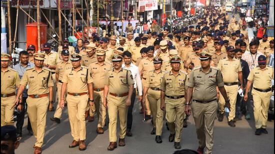 Ahead of the Ganesh Visarjan processions, the Pune police, including commissioner Amitesh Kumar (C), conducted route marches across key areas of the city on Thursday. PMC is all set for immersion of Ganesh idols on Friday by deploying 120 lifeguards and 37 fire brigade personnel at 15 immersion ghats across the city for safety purposes. (MAHENDRA KOLHE/HT)