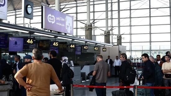 Passengers queue at the terminal hall after flights resumed at Imam Khomeini International Airport.