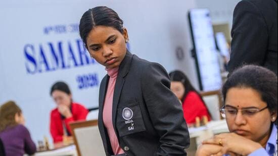 Indian IM Savitha Shri, who has won all her seven games, watches teammate Koneru Humpy’s game in the Fide Chess Olympiad in Samarkand. (FIDE)