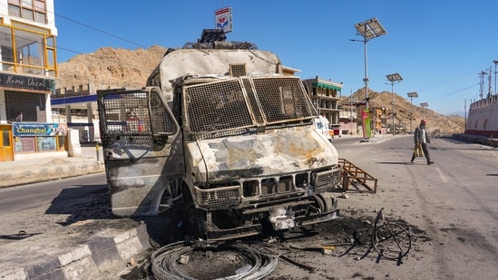 Charred remains of a vehicle lies in the aftermath of violent clashes between demonstrators and police during a protest in Leh, Thursday, Sept. 25, 2025.
