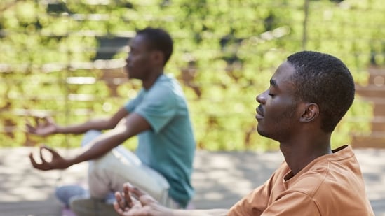 A representative image of two people practising meditation. (Pexels)