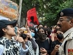 A Lady Shri Ram College (LSR) student argues with a police officer during "Call for Solidarity March" over the gang rape of a 17-year-old girl near Aastha Kunj at National Park, in New Delhi on Wednesday (ANI)