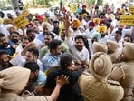 AAP supporters protesting against the Enforcement Directorate raid at the GMADA office in Mohali on Thursday. (Ravi Kumar/HT)