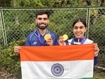Kamaljeet Singh and Suruchi Singh pose for a picture holding the national flag after winning the gold medal.