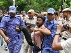 Jantar Mantar news: Security personnel detain an All India Students' Association (AISA) member during a protest against CEC Gyanesh Kumar outside Jantar Mantar, in New Delhi.