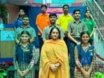Monika Sharma of Sugam NGO with the students at her school in South City-1, in Gurugram, on Thursday. (HT Photo)