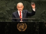 Israeli Prime Minister Benjamin Netanyahu holds a device as he speaks speaks during the 81st session of the United Nations General Assembly at United Nations headquarters.