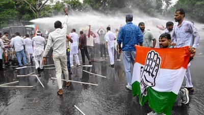 Police uses water cannons to stop the Bihar Pradesh Congress Committee members and supporters during a protest march towards the Election Commission Office. (ANI) Police uses water cannons to stop the Bihar Pradesh Congress Committee members and supporters during a protest march towards the Election Commission Office. (ANI)