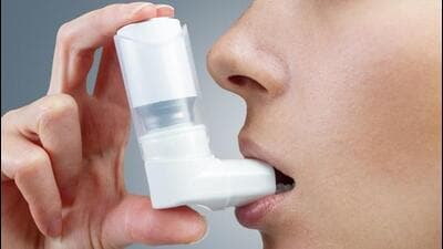Asthma patient taking a puff (For representation only) Asthma patient taking a puff (For representation only)