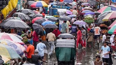 Kolkata: People wade through a busy local market during rain triggered by a weather system over the Bay of Bengal, in Kolkata, Thursday, Sept. 24, 2026. (PTI Photo/Swapan Mahapatra)(PTI09_24_2026_000199B) (PTI)