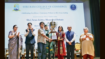 Vice-President CP Radhakrishnan (centre) presents awards to winners of the 3rd Arun Jaitley Memorial Debate at Shri Ram College of Commerce in New Delhi on Friday. (X/@VPIndia)
