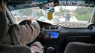A radio can be seen in an taxi transporting passengers in Kabul (AFP) A radio can be seen in an taxi transporting passengers in Kabul (AFP)