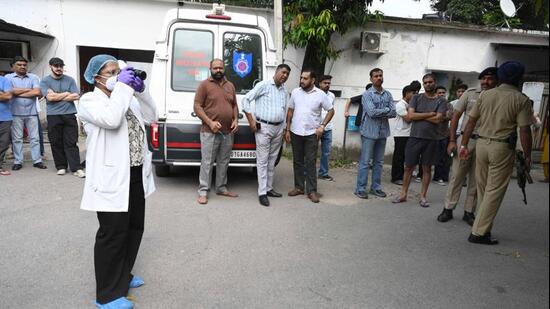 A forensic team outside the house of Nitin Kumar, a UT Police head constable, who was shot dead in Sector 22 on Friday morning. (Keshav Singh/HT)
