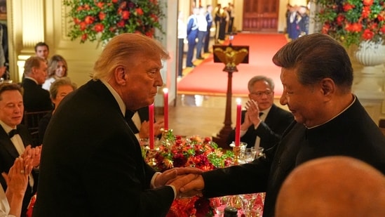 President Donald Trump shakes hands with China's President Xi Jinping in the East Room of the White House during a State Dinner, Thursday. President Donald Trump shakes hands with China's President Xi Jinping in the East Room of the White House during a State Dinner, Thursday.