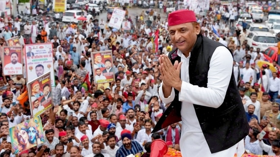 Samajwadi Party chief Akhilesh Yadav greets supporters while leading a roadshow ahead of the 2027 Uttar Pradesh Assembly elections in Rae Bareli, Uttar Pradesh. (PTI)