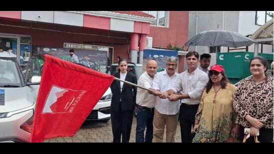 The event witnessed enthusiastic participation from local EV enthusiasts and environmental activists navigating a fleet of electric cars. (HT Photo)
