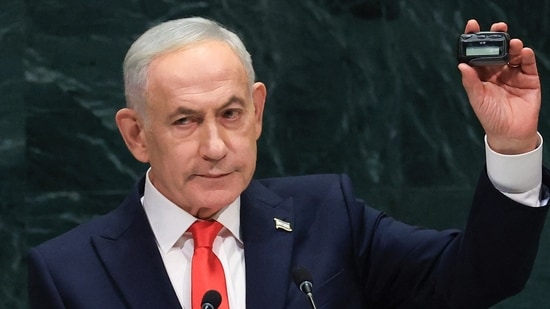 Israel's Prime Minister Benjamin Netanyahu holds up a pager as he speaks during the 81st United Nations General Assembly at the United Nations Headquarters in New York, on September 24, 2026. 