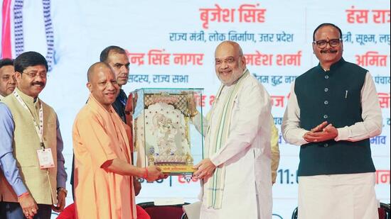 Union home and cooperation minister Amit Shah being felicitated by chief minister Yogi Adityanath at the fourth edition of the UP International Trade Show (UPITS 2026) at the India Expo Centre and Mart, in Greater Noida on Friday. Deputy chief minister Brajesh Pathak and UP cabinet minister Nand Gopal Gupta Nandi also present. (ANI PHOTO)