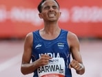 India's Sawan Barwal crosses the finish line to finish second in the men's marathon final during the 2026 Asian Games at Nagoya City Mizuho Park Athletic Stadium in Nagoya, Aichi Prefecture on September 26, 2026. 