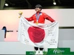 Japan's Yuki Kurihara celebrates with his gold medal after winning the Puyo Puyo Champions esports final at the Asian Games in Nagoya, Japan