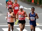 North Korea's Il Ryong Han, Japan's Ichitaka Yamashita and India's Sawan Barwal in action during the Men's Marathon final