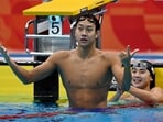 China's Zhang Zhanshuo celebrates after winning gold medal in Men's 400m Freestyle