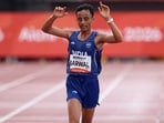 India's Sawan Barwal crosses the finish line in second place to win silver in men's marathon.