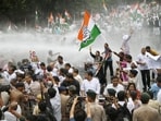 Police use water cannons to stop the Bihar Pradesh Congress Committee members and supporters during a protest march in Patna, Friday. (SANTOSH KUMAR/HT)