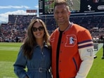 Tim Tebow with wife Demi-Leigh at an NFL game.