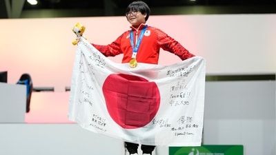 Japan's Yuki Kurihara celebrates with his gold medal after winning the Puyo Puyo Champions esports final at the Asian Games in Nagoya, Japan (AP Photo/Dita Alangkara)
