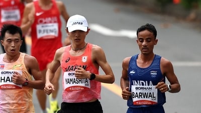 North Korea's Il Ryong Han, Japan's Ichitaka Yamashita and India's Sawan Barwal in action during the Men's Marathon final (REUTERS)