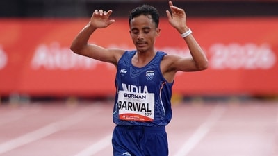 India's Sawan Barwal crosses the finish line in second place to win silver in men's marathon. (REUTERS)