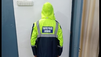 The new raincoats make the cops stand out on rain-soaked roads (HT Photo) The new raincoats make the cops stand out on rain-soaked roads (HT Photo)