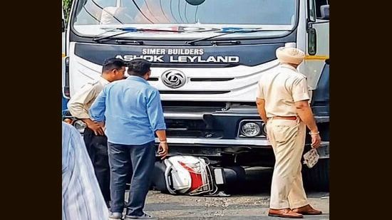 A police official inspecting the accident site on Mall Road in Ludhiana. (HT)