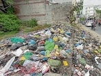 A view of damaged roads, garbage dump lying on the parks and road side in ward number 2. (Gurpreet Singh/Hindustan Times)