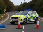 Police officers block a road near the RAF Fairford airbase after police declared a major incident at the base after several men were arrested on suspicion of offences under the Explosives Act, in Fairford, Gloucestershire, Britain, September 27, 2026. REUTERS/Toby Shepheard