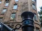 The Tata Group logo is displayed on a pedestrian safety pole near Bombay House, the Tata Group headquarters building, in Mumbai. 