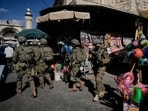Israeli soldiers take positions during a military operation at a market in Nablus, West Bank, Sunday, Sept. 27, 2026.