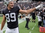 Brock Bowers of the Las Vegas Raiders waves to fans after warming up before a preseason game against the Arizona Cardinals at Allegiant Stadium on August 13.(Getty Images via AFP)