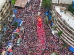 People take part in a Ganesh visarjan procession in Mumbai.