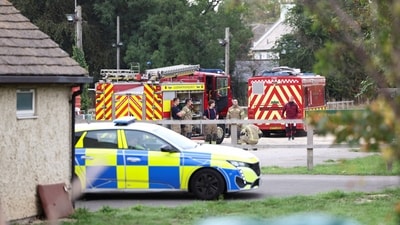 Emergency vehicles are parked at Fairford Youth Football club, near RAF Fairford, which hosts US Air Force personnel, in Fairford, Gloucestershire, Britain (REUTERS)