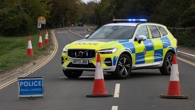 Police officers block a road near the RAF Fairford airbase after police declared a major incident at the base after several men were arrested on suspicion of offences under the Explosives Act, in Fairford, Gloucestershire, Britain, September 27, 2026. REUTERS/Toby Shepheard (REUTERS)